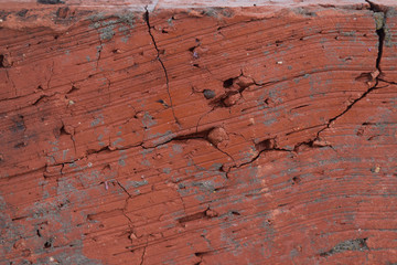 The texture of the old brick. Cracked, burned red clay-close-up. Construction material.