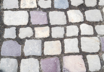 Old stone road. Pattern of stones as a background.