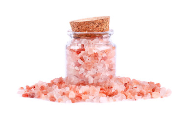 Himalayan pink salt in glass jar, isolated on white background. Himalayan pink salt in crystals.