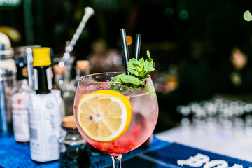 Closeup of fresh cocktail at bar counter.