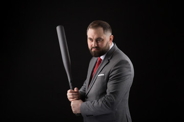 bearded Man in suit and red tie with baseball bat