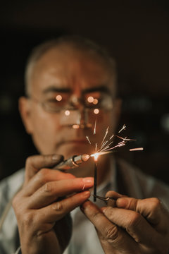 Artisan soldering precious metal, portrait