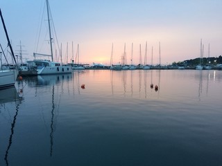 Fototapeta na wymiar Boats, marina at dawn, sunrise clouds,Thessaloniki Greece 