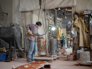 Art foundry, Foundry worker lifting casting mold