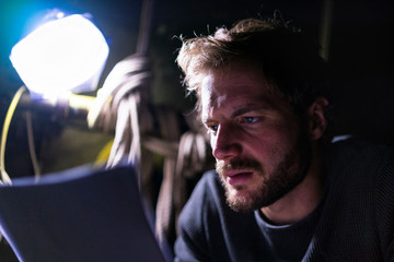 Portrait of actor at theatre studying script backstage