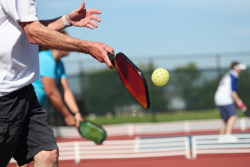 Pickleball is played outdoors
