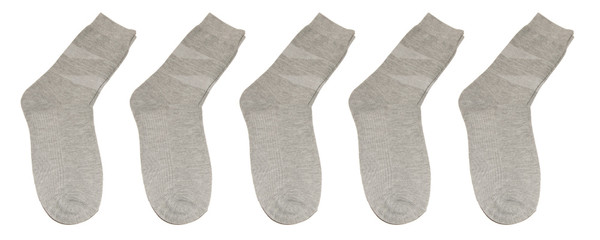 Set of gray socks isolated on white background. Five pairs of gray socks. In isolation. Socks in a row on a white background.