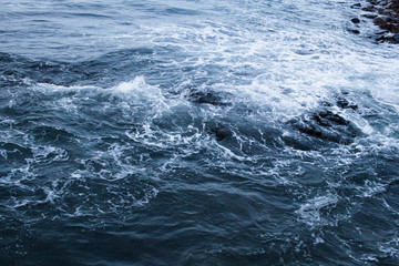 Dark blue nothern ocean waves in winter. Water surface