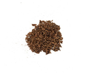 Grated chocolate. Heap of ground chocolate isolated on white background with clipping path, closeup.