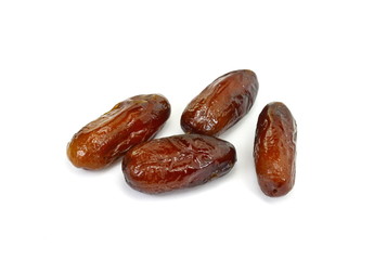 Dried dates over white background. Heap of dried dates isolated on white background.