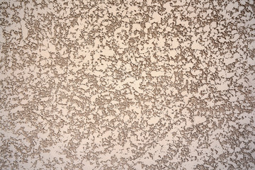 Rough decorative cement plaster on the wall