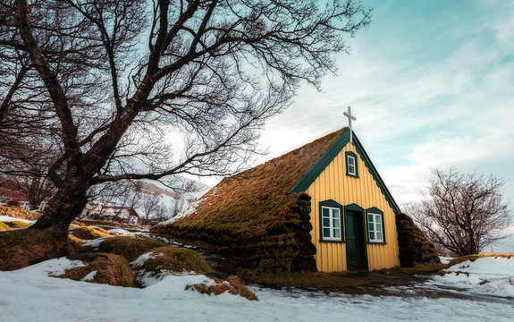 Landscape of turf church Hofskirkja in small village of Hof Iceland