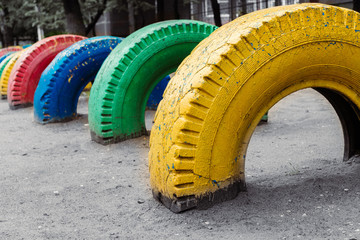 Colourful wheels at the school kids playground 