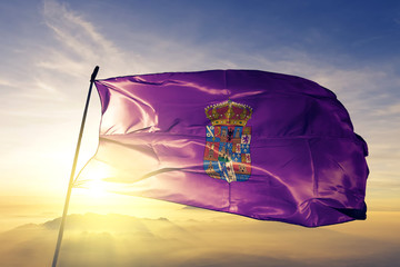 Guadalajara province of Spain flag waving on the top sunrise mist fog