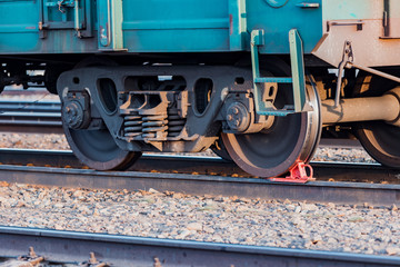 Naklejka premium Railway carriage stands on the rails. Wagon wheels. Rails.