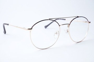 Round glasses for sight on a white background