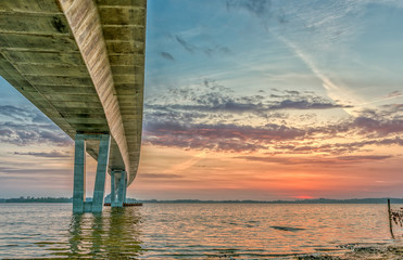 The Roskilde firth and Crown Princess Mary bridge at sunset