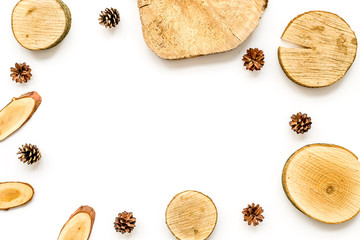 wooden stumps and pine cones frame for blog background top view space for text