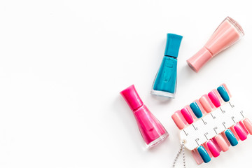 palette and nail polish for nail artist work on white desk background top view mock up