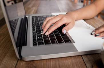 Fototapeta na wymiar Woman using laptop and searching web