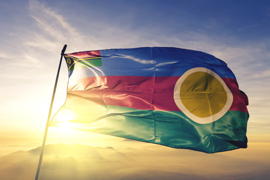 Shefa province of Vanuatu flag waving on the top sunrise mist fog