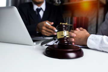 Lawyers having team meeting with law documents and negotiating contact in office