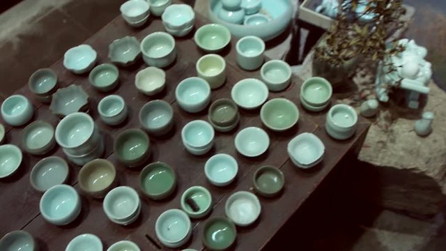 Many Chinese teacups in antique shop in Shanghai.A local seller of new and antique tea cups and tea sets.
