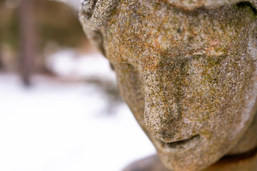 Close up of a stone statue in the winter.