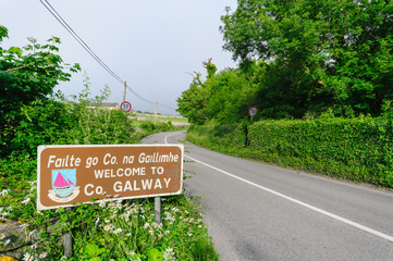 Road sign: "Failte go County na. Gaillihme. Welcome to County Galway"