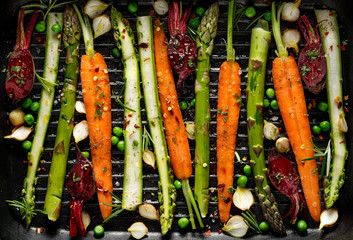 Grilling vegetables, raw vegetables prepared for grilling with the addition of olive oil, herbs and...