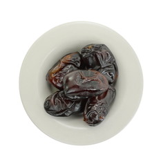 Dried dates over white background. Heap of dried dates isolated on white background.