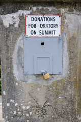 Collection box at foot of St Patrick's statue, Croagh Patrick, "Donations for Oratory on Summit"