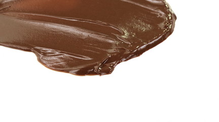 Melted hot chocolate. Drop isolated on white background. Hot melted chocolate pouring isolated on white background, with clipping path