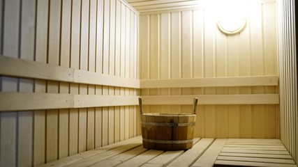 Sauna accessories are in the interior of the steam room. The interior of the sauna. Sauna from linden.