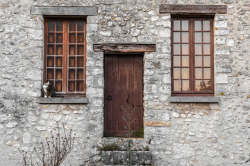 Old building with cat on window sill, Northern France