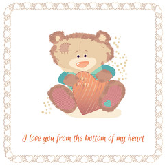 Postcard with a bear cub. A small bear is a toy