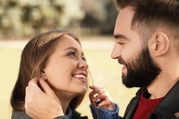 Portrait of cute young couple outdoors, closeup