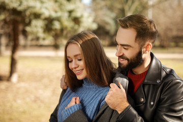 Fototapeta premium Portrait of cute young couple in park on sunny day