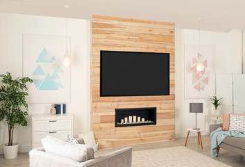 Living room interior with modern TV on wooden wall