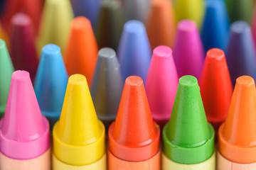 Close up of colorful and pastel crayons