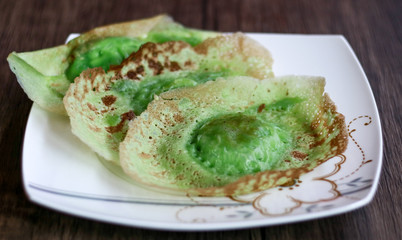 Ape cake or serabi Jakarta on wood background. 