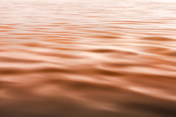 Abstract Seascape, Sunset over the Ocean. Water Surface, Play of Ripples
