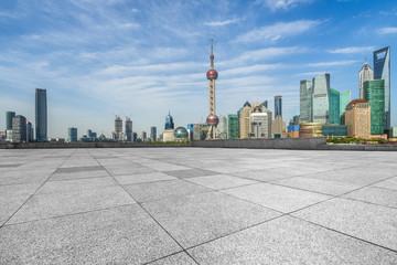 empty square and city skyline under blue sky, shanghai city, china.