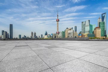 Fotobehang empty square and city skyline under blue sky, shanghai city, china. © hallojulie