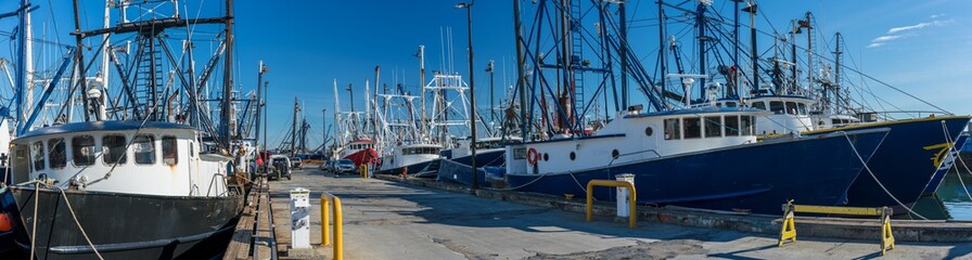 Naklejka premium Landscape panoramic view of Commercial phishing boats harbor, repair shop