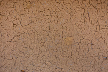 Cracks on a clay wall of a Japanese house at Michinoku Folklore Village in Kitakami, Japan