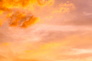 Sunset sky clouds trees orange. Colorful abstract background with fiery orange sky and clouds at sunset