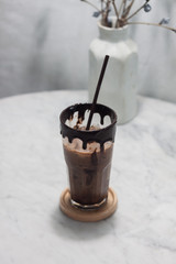 Ice coffee on wooden table