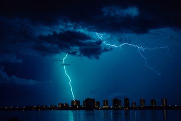 Thunderbolt and Lightning.night thunderstorm over the buildings in the city