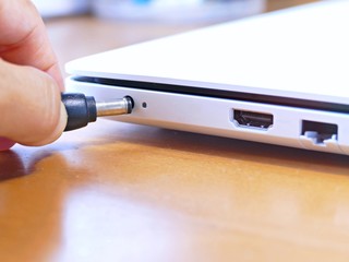 the plug  power adaptor to recharge the notebook. The concept of electronic device for use everyday...